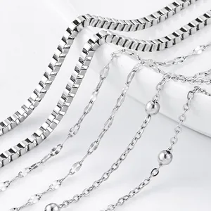 Macro view of various silver-toned titanium steel necklace chains in different styles