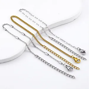 Detail view of various stainless steel chain bracelets with lobster clasps and extenders