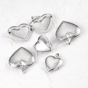 Close-up of polished and engraved heart lockets showing open and closed states