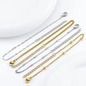 Detail view of assorted stainless steel bracelets in gold and silver finishes