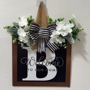 Personalized wooden front door sign with letter B floral decor and welcome text