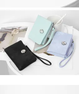 Detail view of fashionable women's short wallets with rhinestone decor and wristlets