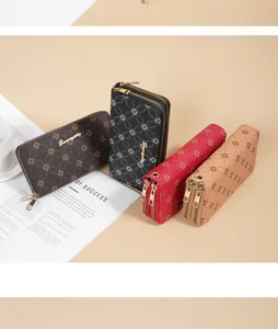 Detail view of multiple elegant double-zipper long wallets in various colors