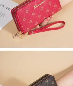Detailed view of the soft leather texture and double zippers on the women's long wallet.