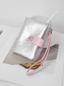 Silver metallic crinkle leather wallet with pink wristlet and elegant pearl charm