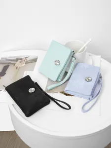 Three colors of fashionable women's wristlet wallets with sparkling crystal buckles