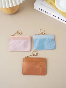 Set of slim women's card holders with zippers and keychains in three assorted colors