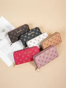 Collection of women's long double zipper wallets with clover pattern in various colors