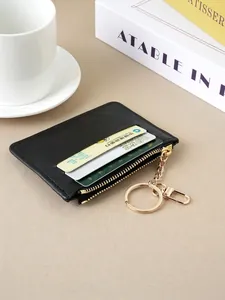 Slim black faux leather card holder wallet featuring a gold zipper and keychain attachment