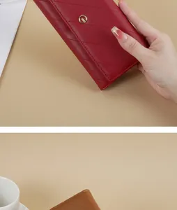 Detailed view of an elegant red quilted faux leather long wallet with gold buckle for women