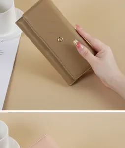 Close-up of a stylish tan long wallet with diagonal quilted texture and gold clasp