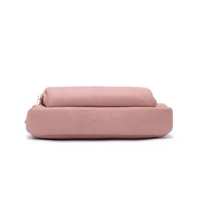 Detailed bottom view of a pink double-layer textured faux leather women's clutch bag