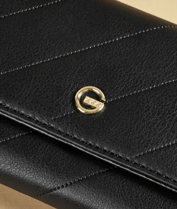 Close-up of black quilted leather women's wallet with gold G-logo hardware buckle