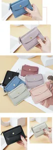 Detail view of colorful mini PVC wallets featuring zipper and snap button front pocket