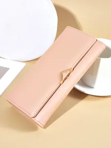 Elegant pink PU leather long wallet for women featuring a stylish golden V-clasp hardware detail