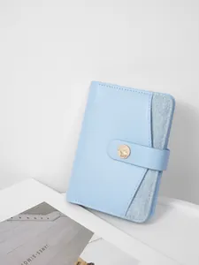Light blue multi-functional travel passport holder with leather and denim textures