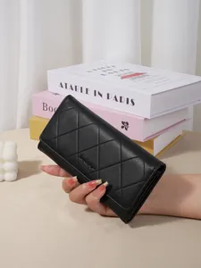 Elegant black long wallet for women featuring a classic quilted diamond pattern design