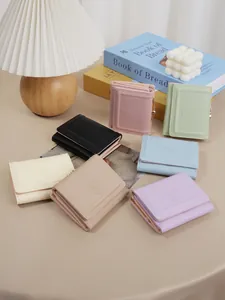 Short multi-functional wallet with cute bunny design in various pastel colors.