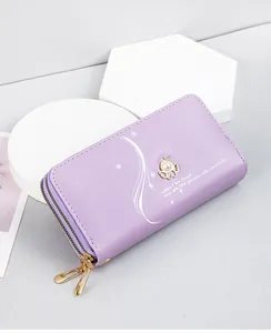 Lilac women's long wallet featuring double zippers and a delicate pearl bird charm