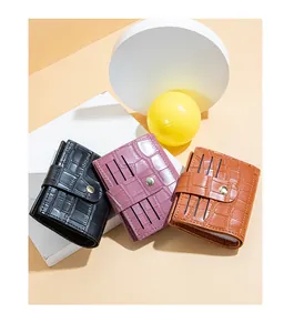 Variety of three stylish stone-patterned women's short wallets featuring secure buckle closure