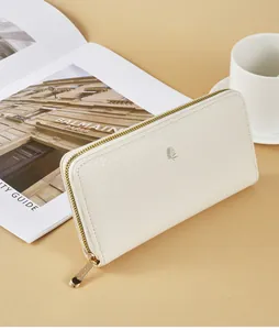 Detailed view of the elegant cream lychee grain leather zip-around long clutch wallet