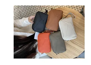 Macro view of genuine leather phone wristlet bags available in five elegant colors.