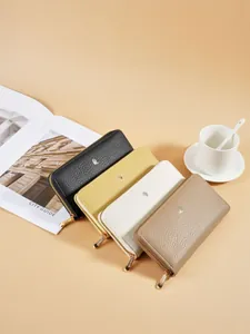 Elegant women's lychee grain long wallets with single zipper and metal leaf detail