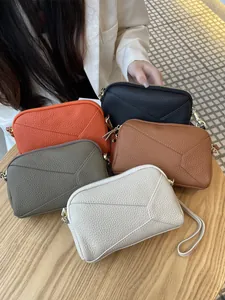 Genuine leather phone wristlet bags with geometric stitching in multiple colors