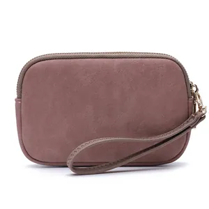 Elegant mauve double-zipper wristlet clutch bag featuring soft suede-like finish