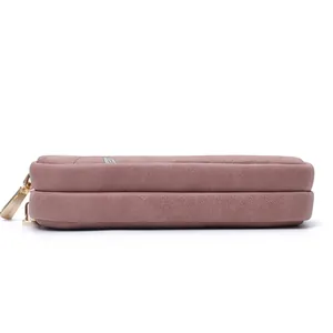 Side view of pink double zipper clutch bag showing dual compartment structure