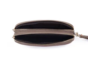 Detailed interior view of a brown double zipper clutch bag with card slots and wristlet