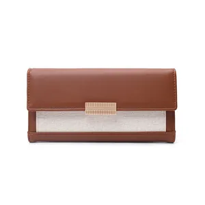 Vintage brown and beige color-blocked long wallet with woven texture and gold hardware.