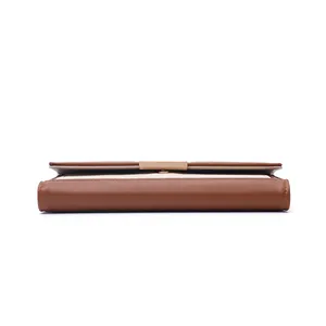 Detailed side view of a vintage color-block long wallet for women with gold clasp