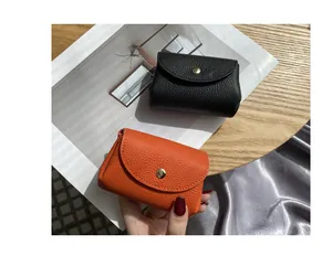 Compact pebbled leather coin purses in black and orange with snap closure