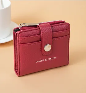 Red litchi texture PU leather wallet with multiple card slots and silver snap button closure.