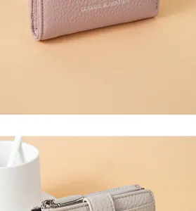 Close-up detail of litchi grain PU leather wallet showing zipper and silver hardware