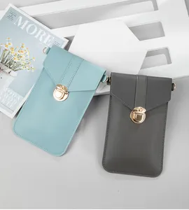 Close-up of minimalist phone crossbody bags with metal lock in blue and grey.