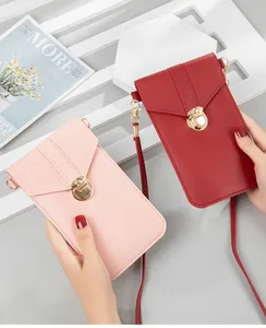 Close-up of pink and red crossbody cell phone bags with secure metal locks