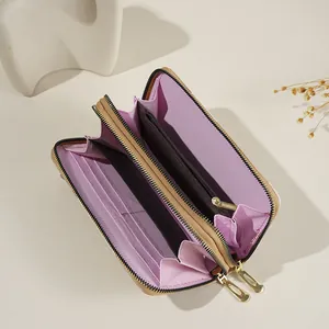 Cartera retro bicolor de cuero con doble cremallera y múltiples ranuras.