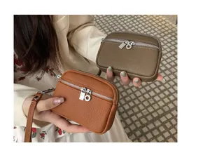 Mini double zipper coin purse in brown and olive green with stylish textured leather detail