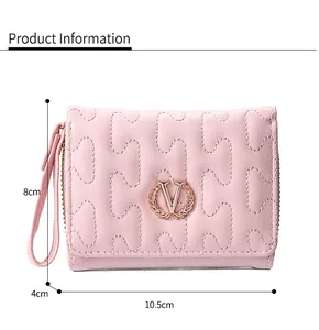 Compact pink leather wallet with wavy stitching and gold wreath V logo detailing.