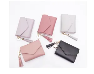 Detailed display of colorful women short wallets featuring lovely heart tassel charms