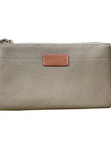 Elegant small pebbled leather clutch bag with zipper and decorative brown leather patch