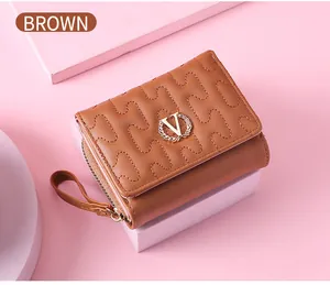Detailed view of a brown women's short wallet with wave stitching and gold V logo