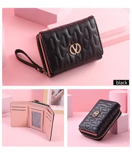 Detailed views of black wave-quilted short wallet with wheat-ear V logo and pink interior