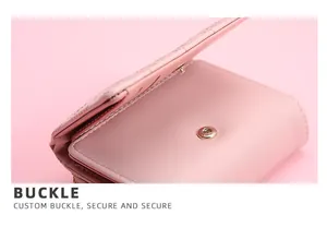 Close-up detail of the metal snap buckle on a pink stitched leather women's wallet