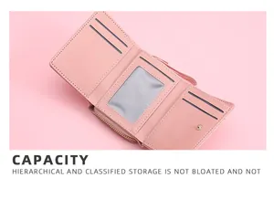Internal detail showing card slots and storage capacity of pink trifold wallet