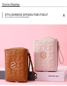 Detailed view of wave-stitched short wallets in brown and pink with gold V-logo accents.