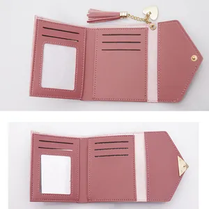 Elegant pink trifold wallet for women featuring heart tassel and multi-card slots interior
