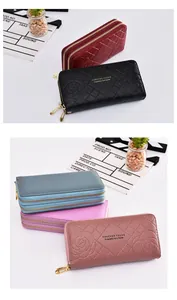 Detailed view showing the elegant rose pattern on double-zipper women's long wallets.